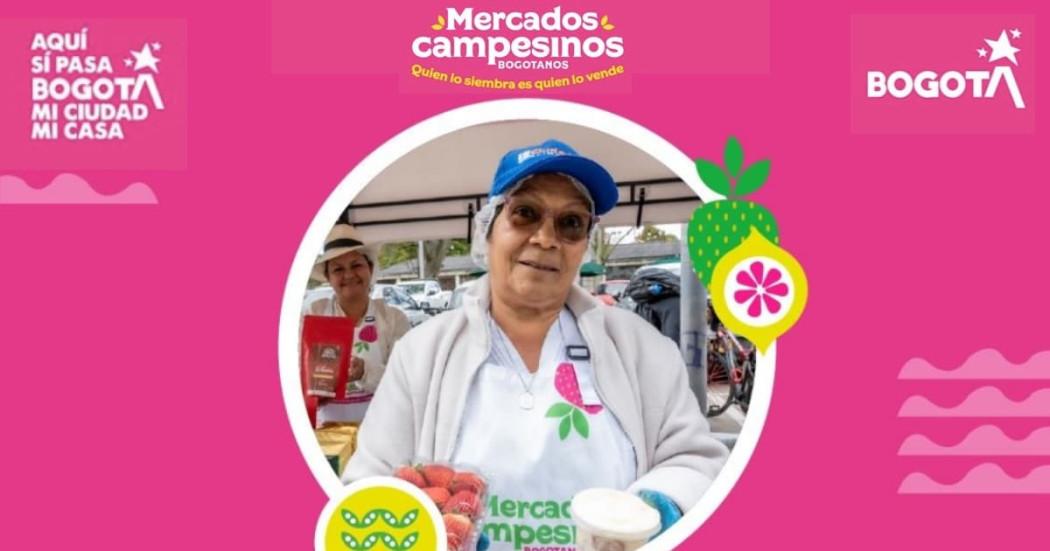 Imagen de los Mercados Campesinos en Bogotá con uno de los campesinos participantes.