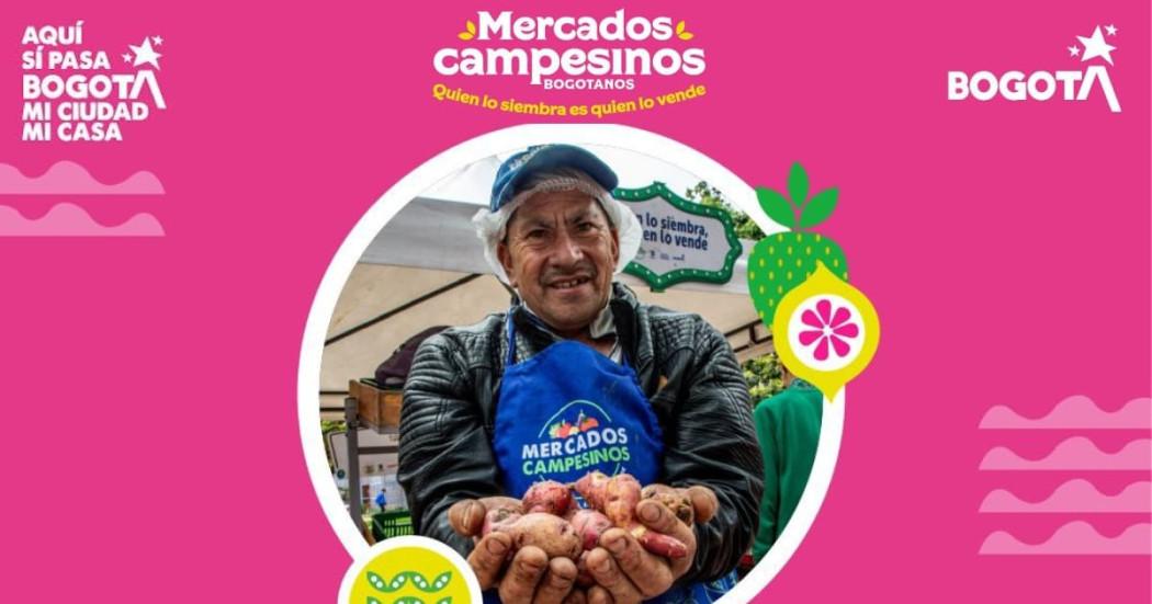 Imagen de los Mercados Campesinos en Bogotá con uno de los campesinos participantes.