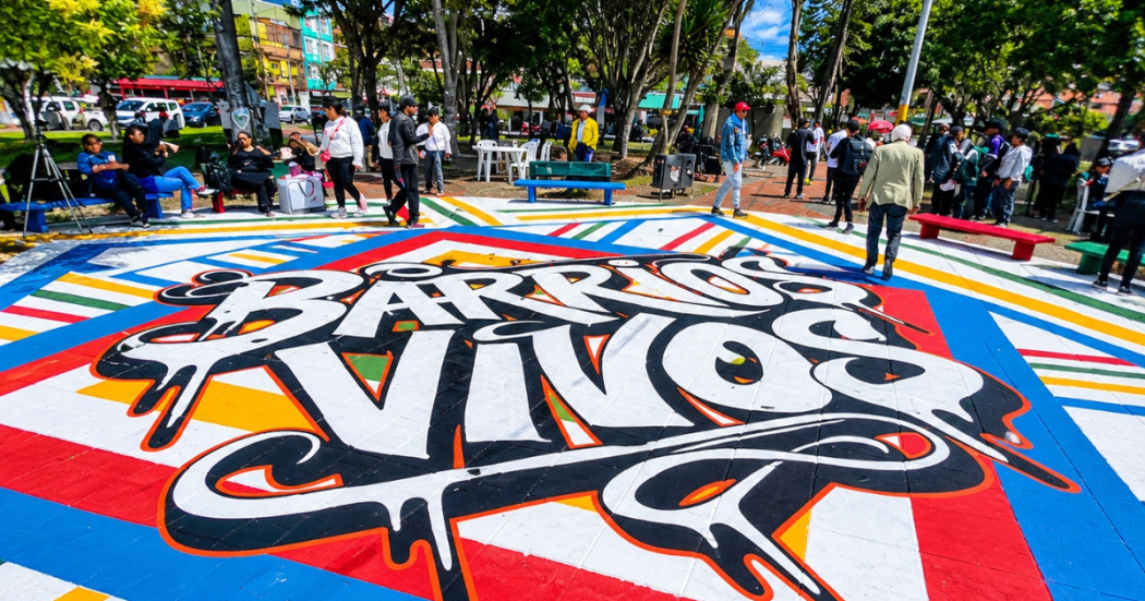 Foto de un suelo pintado con la palabra Barrios Vivos