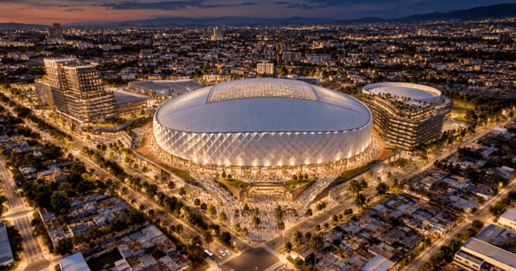 Vista aérea nocturna del diseño del nuevo estadio El Campín, con cubierta retráctil iluminada y entorno urbano circundante.