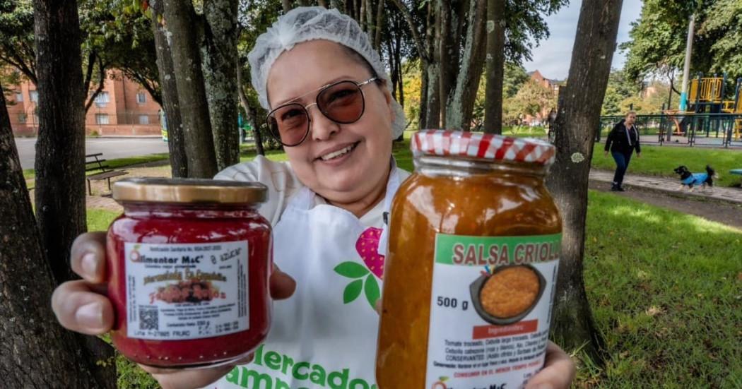 Foto de una mujer campesina en una de lasa ferias de Mercados Campesinos.