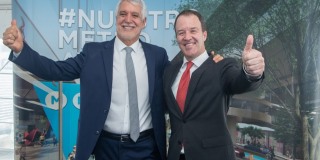 Retrato del alcalde Peñalosa y el gerente Andrés Escobar.