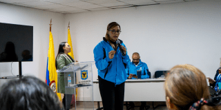 Fotografía de una funcionaria del sector salud durante el dialogo que se realizó en Bogotá.