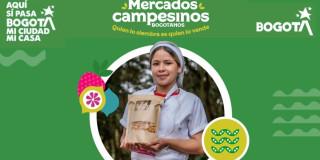 Imagen de los Mercados Campesinos en Bogotá con uno de los campesinos participantes.