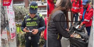 Foto que muestra un policia y personas recogiendo basuras 