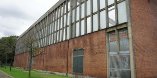Fachada de los coliseos menores de la Unidad Deportiva El Salitre, escenario donde el IDRD proyecta iniciar obras de construcción y modernización en 2026.