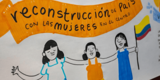 Dibujo en el que se lee "Construcción de país con las mujeres en el centro".