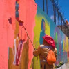 Hombre pintando una pared del secto.