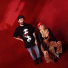 Imagen de Pablo 'Melov' y Tattiana Echeverri (LeTatt) en un fondo rojo 