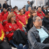 Personas sentadas en filas de sillas durante un encuentro ciudadano en un auditorio.