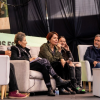 Imagen de varias personas sentadas en lo que parece un panel, sentada en el centro habla María Claudia Parias, directora de Idartes.