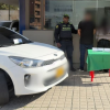 Foto de detenidos junto a policías en Bogotá