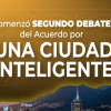 Pieza gráfica con fondo dorado y diseño de circuitos tecnológicos. En el centro aparece el texto: “Comenzó segundo debate del Acuerdo por una Ciudad Inteligente”. En las esquinas superiores se observan los logotipos de Bogotá.