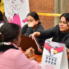 Funcionarias de la Secretaría Distrital de Integración Social el jornada de información sobre Ingreso Mónimo Garantizado