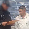 Foto de un ciudadano siendo capturado por un funcionario del Cuerpo Técnico de Investigación (CTI) de la Fiscalía General de la Nación.