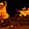 Imagen de cuatro personajes vestidos de campesinos con máscaras, dos son mujeres y dos hombres.